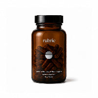 An amber glass bottle of Rubric dietary supplement with a black cap, containing dark brown capsules, on a clean white background.