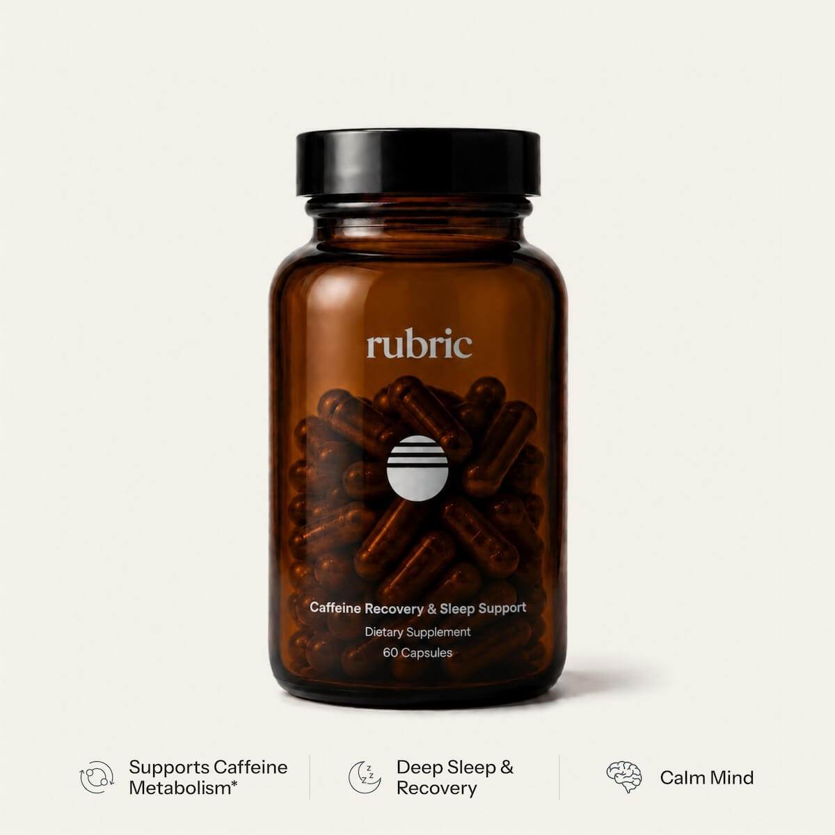 An amber glass supplement bottle with a black cap, labeled 'rubric' and 'Caffeine Recovery & Sleep Support', shown on a light warm-gray background with three feature badges below.